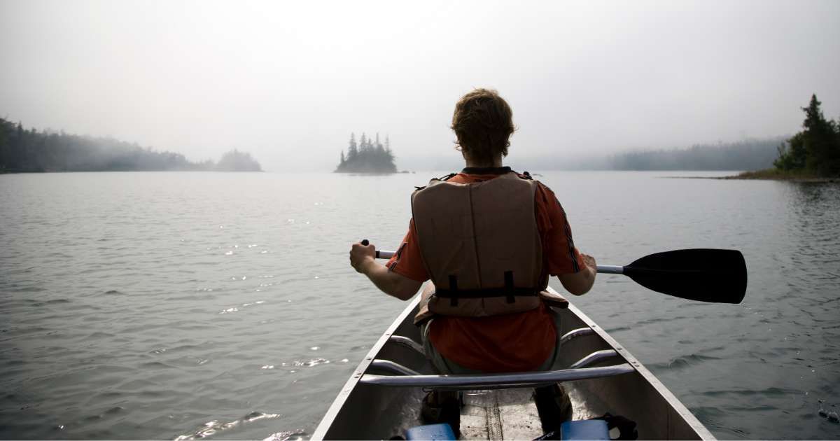 A person paddling in the waters of Lake Superior. (Representative Cover Image Source: Getty Images | Per Breiehagen)