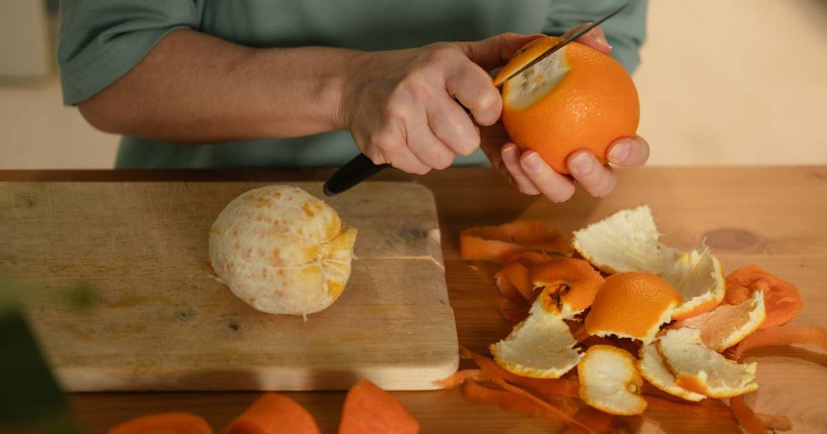 A woman peeling an orange (Representative Cover Image Source: Getty Images | Ekaterina Vasileva-Bagler)