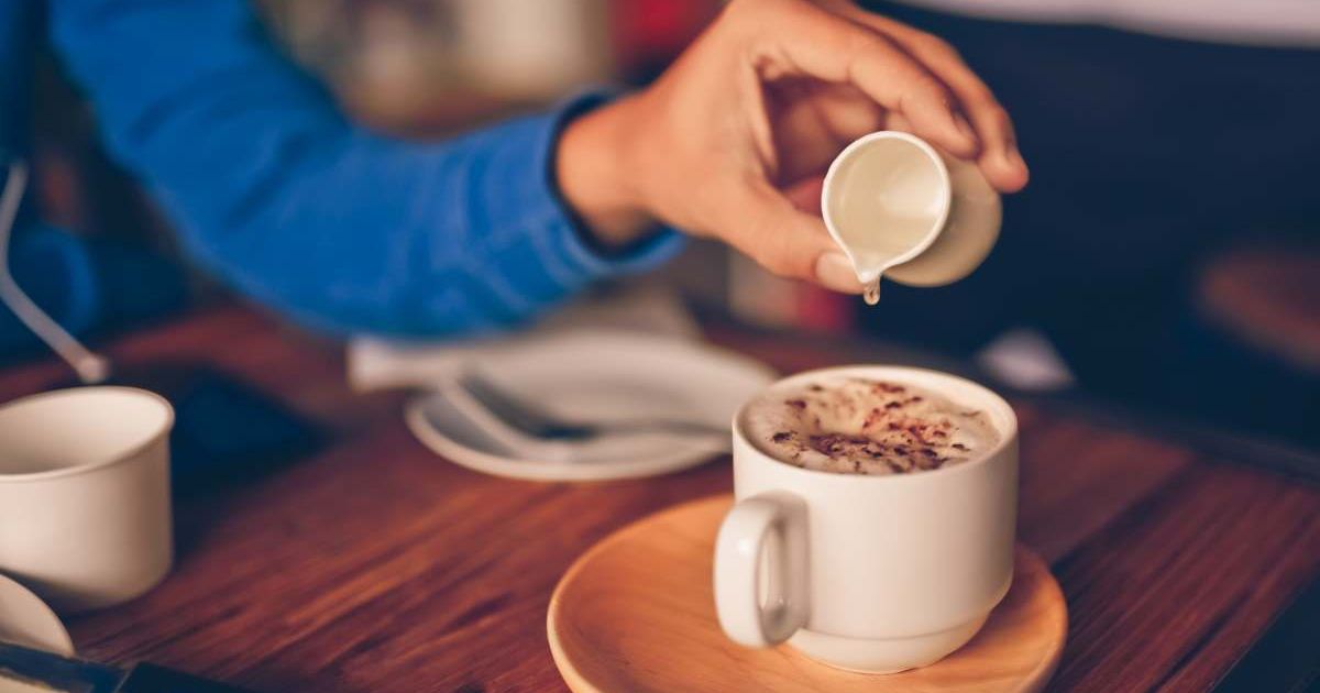 Woman pouring sweetening syrup in her cup of coffee (Representative Cover Image Source: Getty Images | ArisSu)
