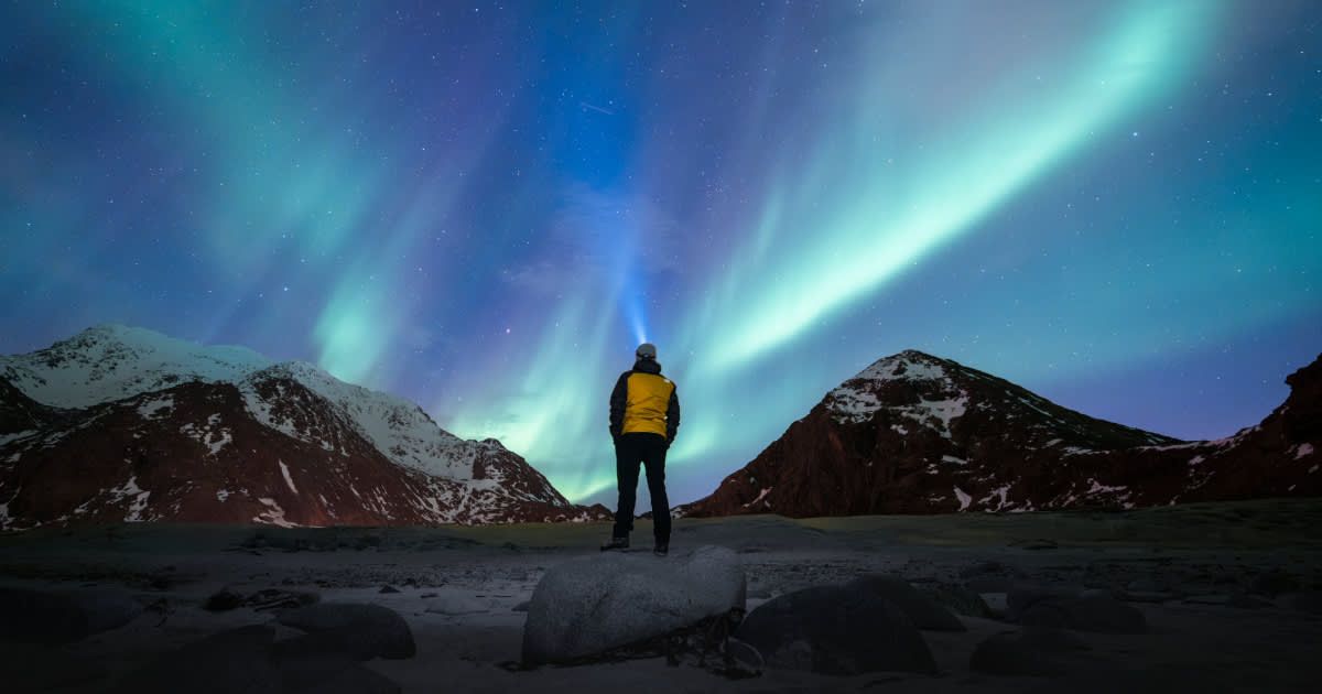 A man gazing at the Northern Lights. (Representative Cover Image Source: Getty Images | Marco Bottigelli)
