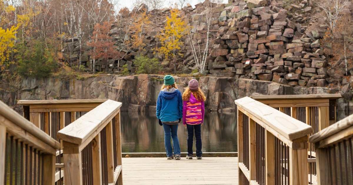 Visitors walking on a boardwalk in a state park in Minnesota (Representative Cover Image Source: Getty Images | Emholic)