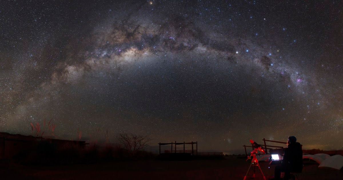 An astronomer with a telescope looking at a galaxy (Representative Cover Image Source: Getty Images | Yuri Zvezdny - Stocktrek Images)