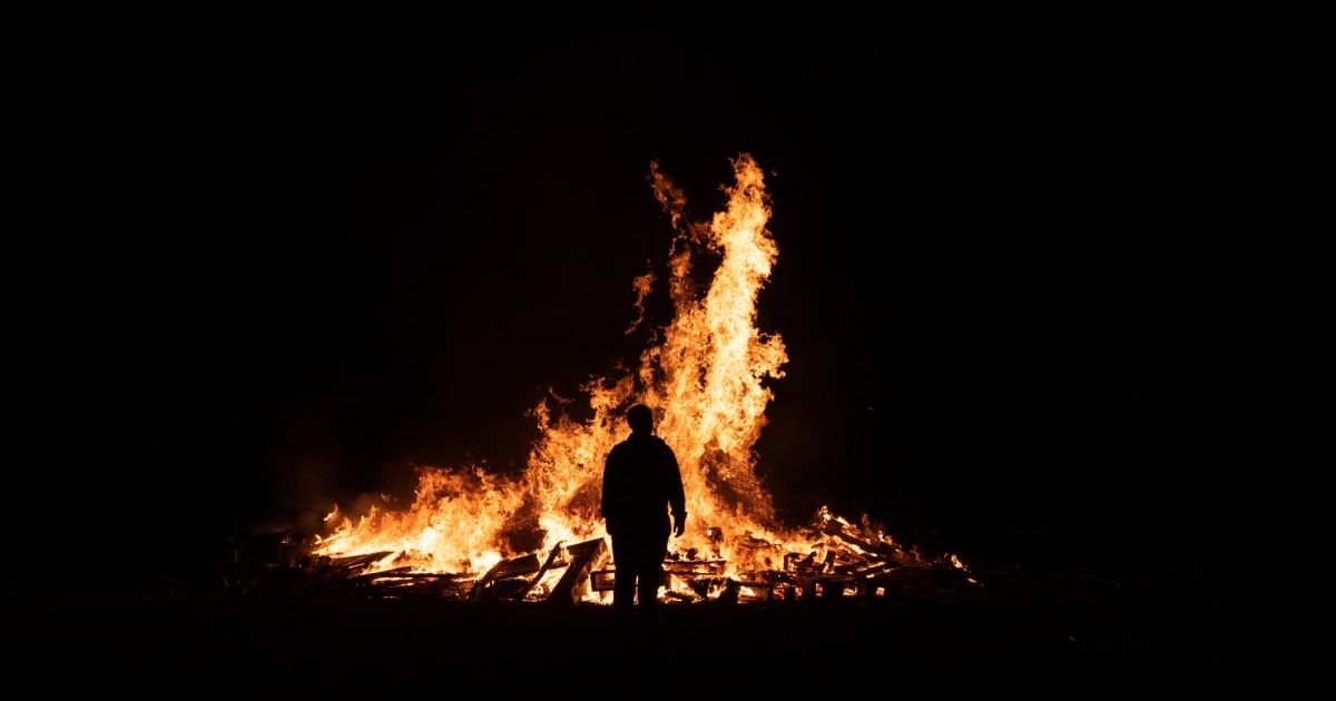 Silhouette of person in front of fire (Representative Cover Image Source: Getty Images | Shay Murphy Photography)