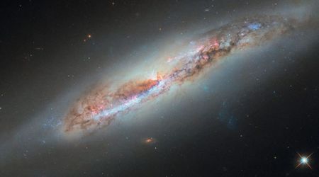 NASA's Hubble Detects Mysterious Plume of Gas Escaping From an Active Spiral Galaxy