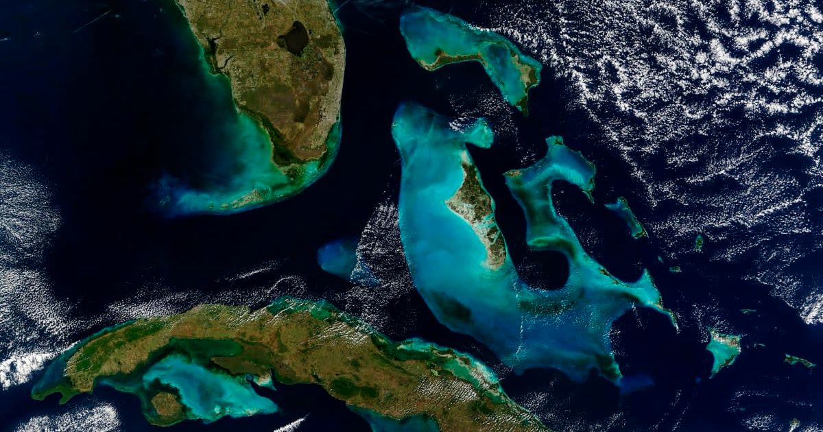 The Great Bahama Bank and Little Bahama Bank are a brilliant blue in contrast to the black of the surrounding ocean. (Cover Image Source: Getty Images | Stocktrek Images)