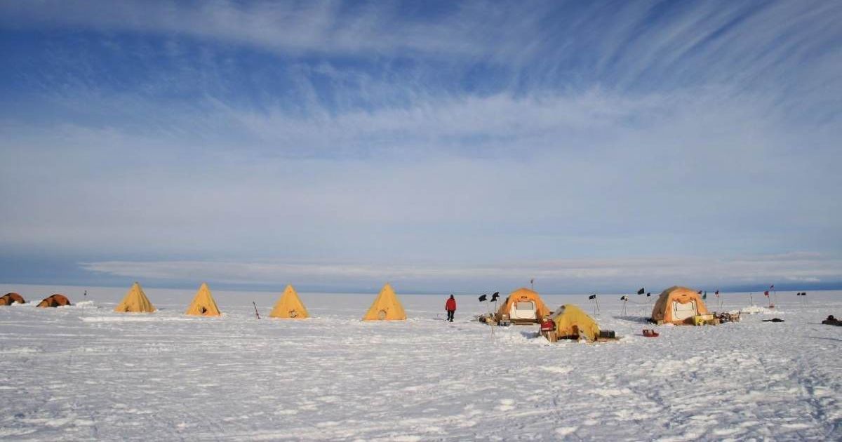 Tents dot the landscape at Cavity Camp on the Eastern Thwaites Glacier Ice Shelf. Scientists reside here as they conduct research as part of the International Thwaites Glacier Collaboration. (Cover Image Source: Ted Scambos, CIRES)