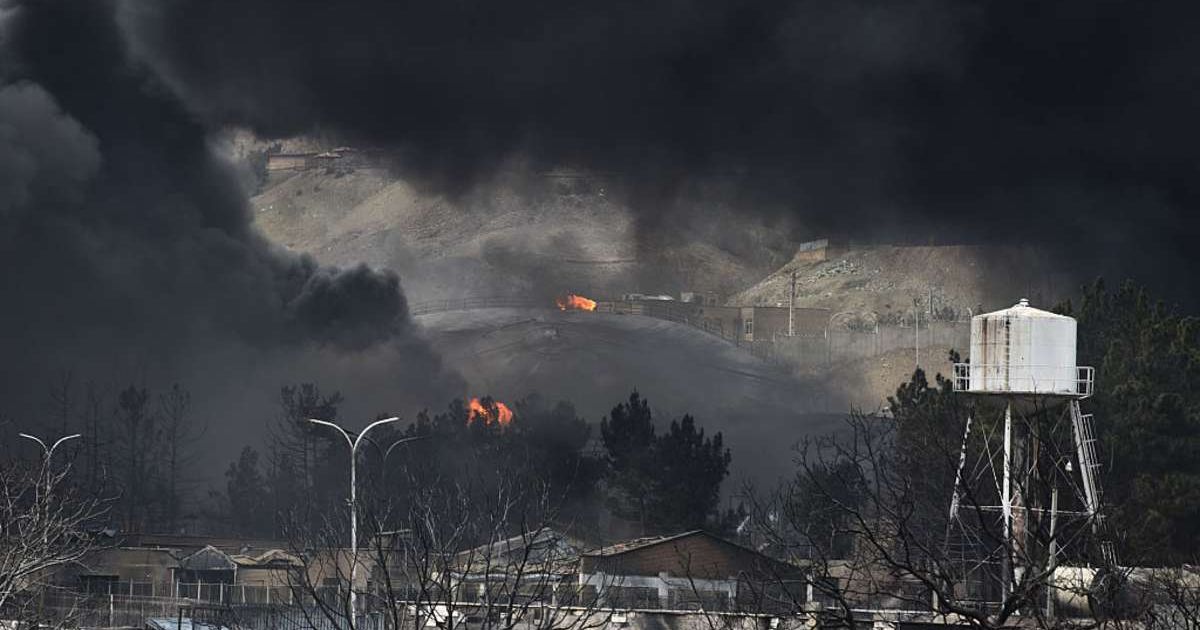 Plumes of smoke rise over the oil depot tanks that were hit in Tehran, Iran, on March 8, 2026. (Cover Image Source: Getty Images | Kaveh Kazemi) 